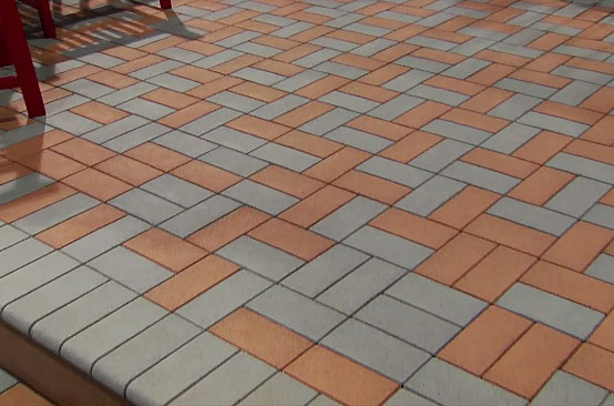 Patio with brick pavers in red and gray pattern 