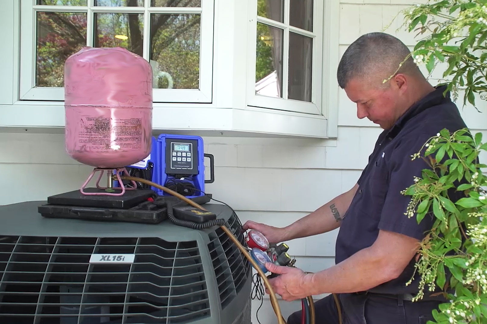 Technician checking AC Refrigerant 