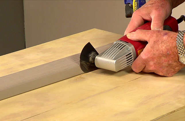 Man cutting with a straightedge