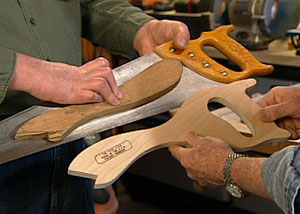 Safer table saw push stick has handsaw handle