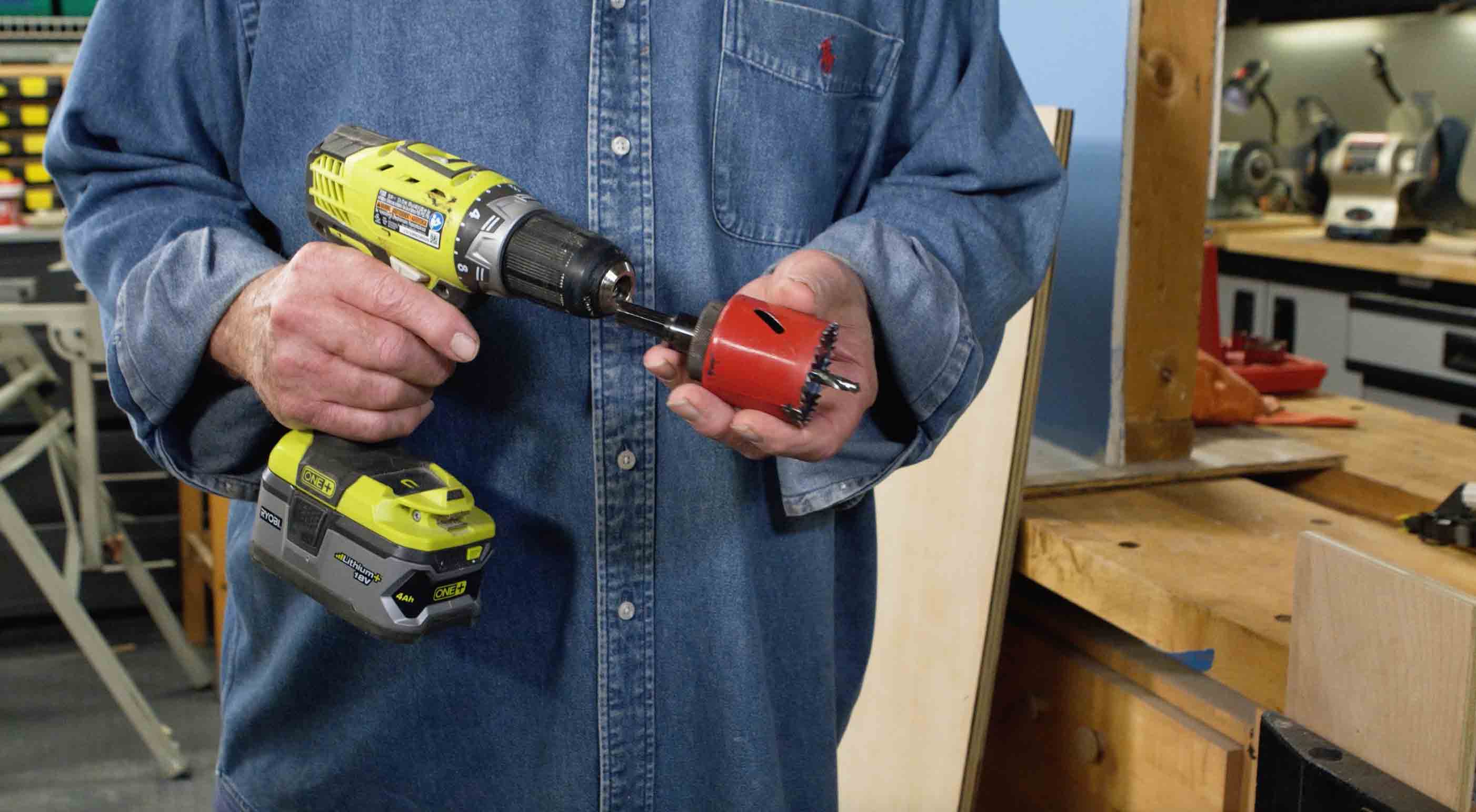 Man attaches hole saw to Ryobi drill 