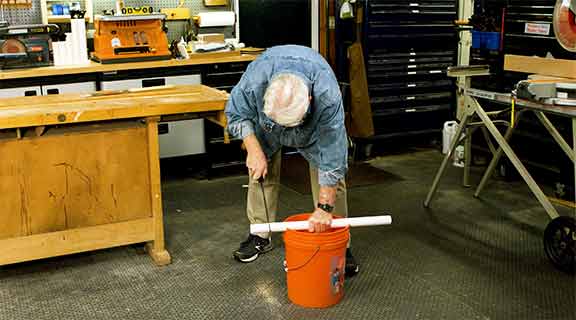Man cutting round object