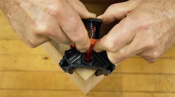Man demonstrates how to use a positioning clamp