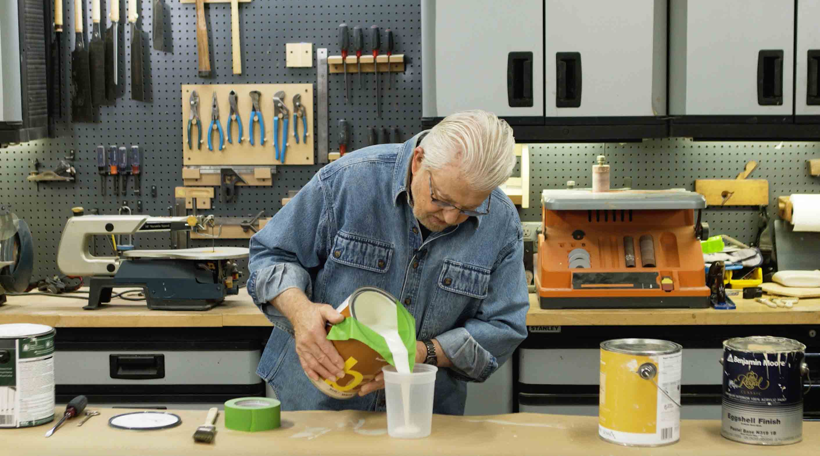 Man makes paint pouring spout from masking tape