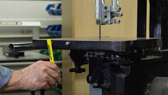 Man attaches a magnetic pencil to a magnetic surface