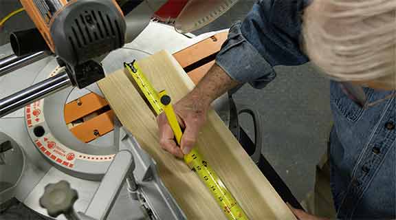 Man uses a magnetic pencil to mark a measurement