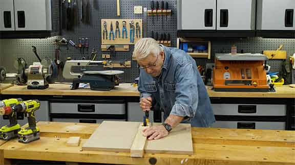 Man uses clamp extension to make clamp longer