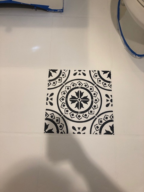 floor stencil removed from tile and painted in black