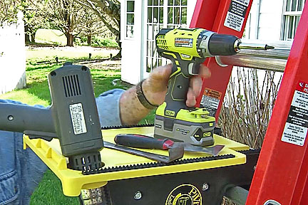 pivit Ladder tool platform holding tools such as a drill