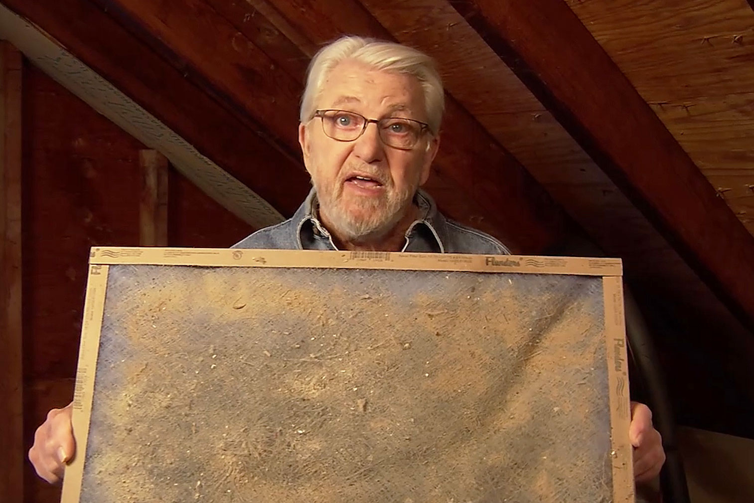 Ron holding a dirty AC home filter