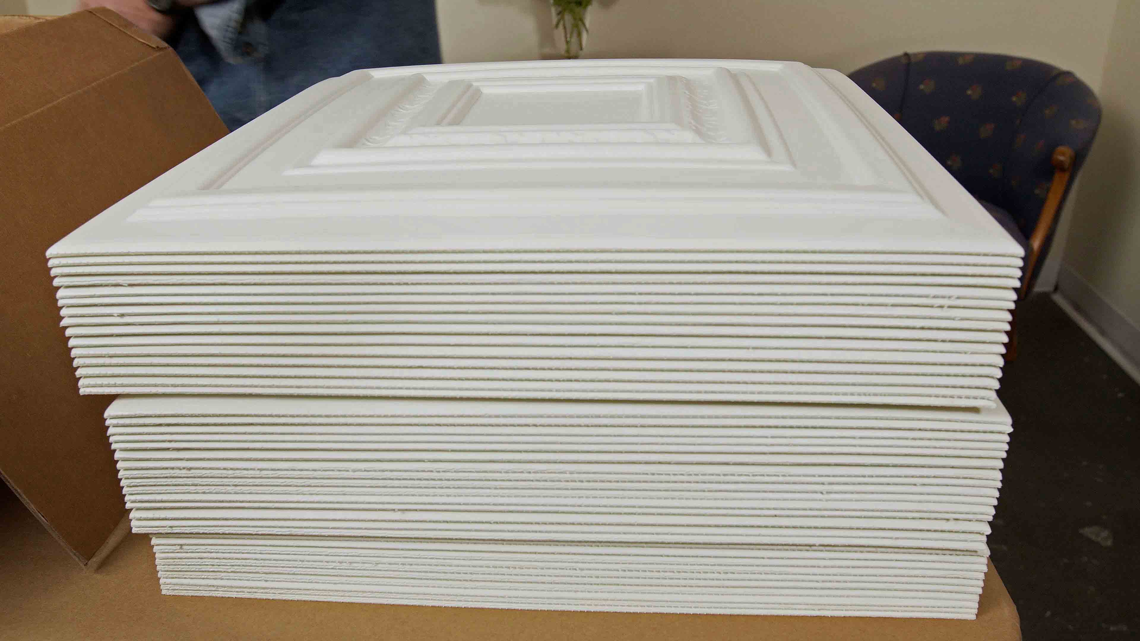 Stack of white foam ceiling tiles 