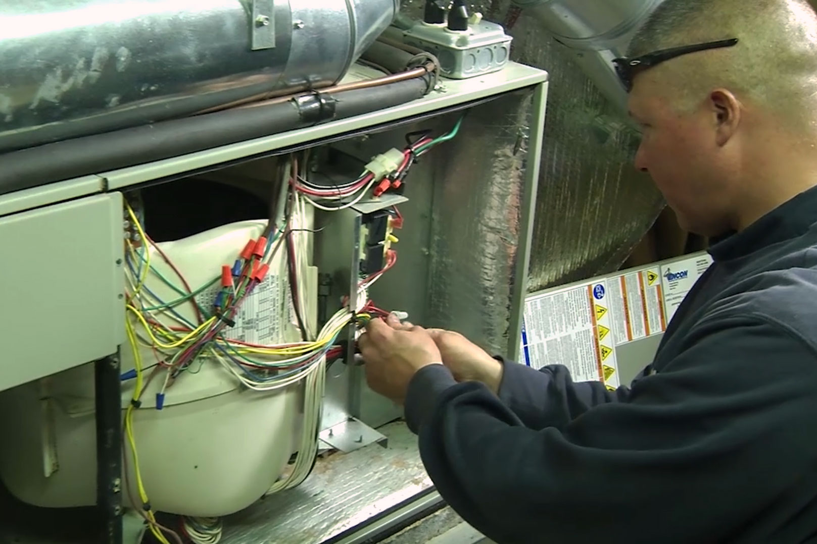 Technician checking air handler 